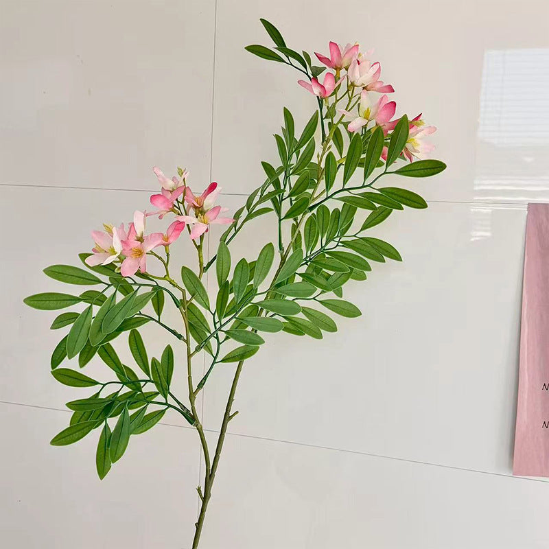 Decorative artificial flower branch with delicate flowers