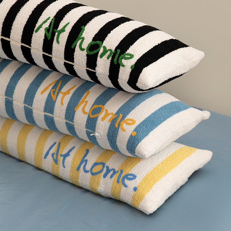 Elongated bench and windowsill cushion with nautical stripe texture and embroidered lettering