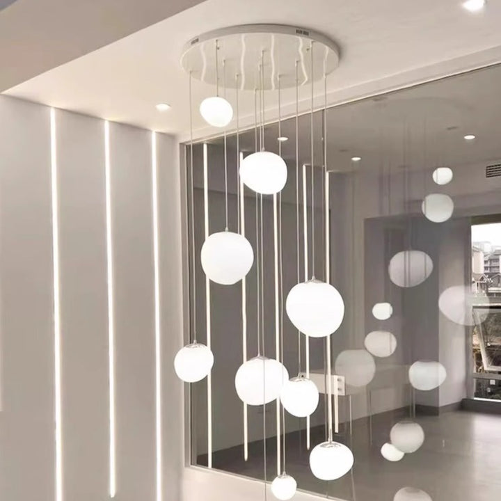 Modern multi-level LED pendant light with satin oval disc shades