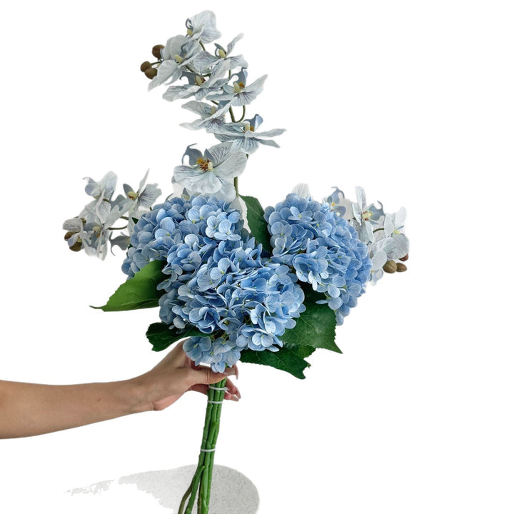 Luxurious artificial flower bouquet with blooming orchids