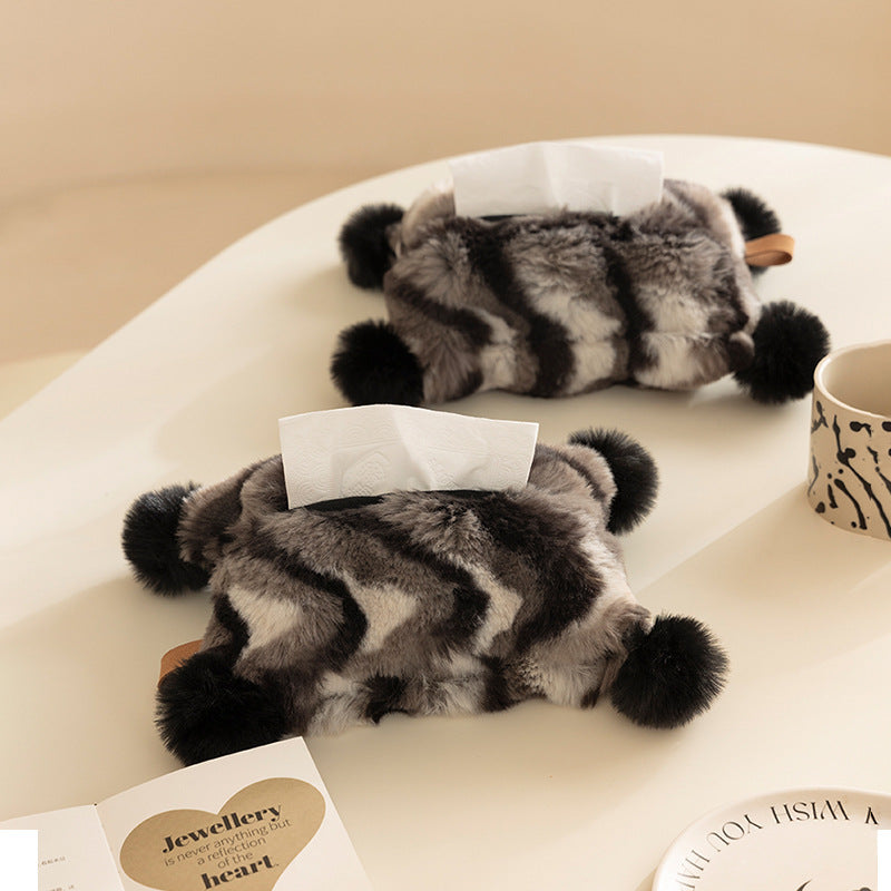 Cozy tissue box cover made of artificial fur with pom-pom application