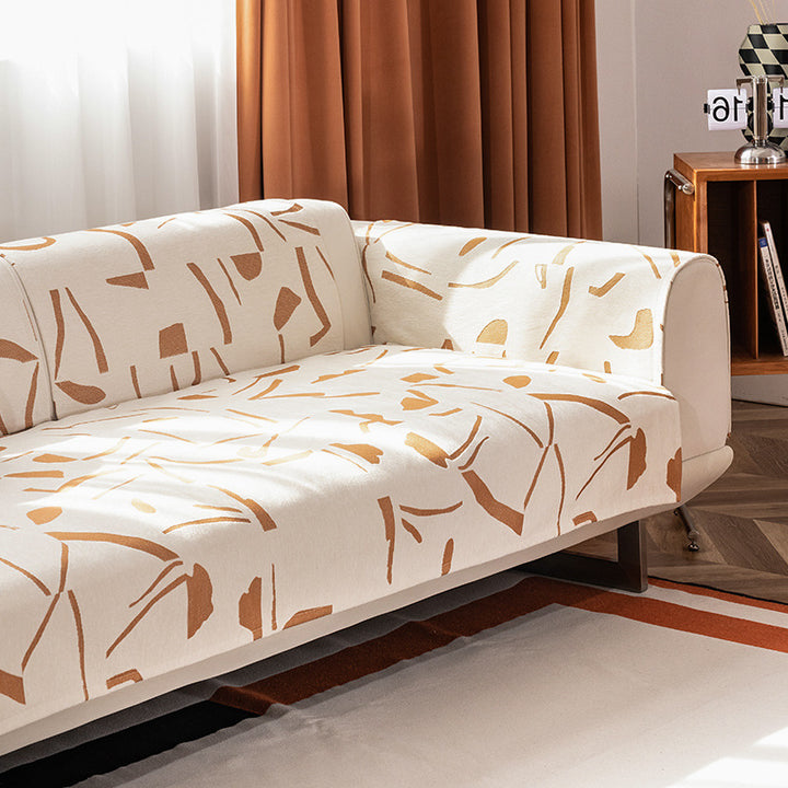 Stretch sofa cover with abstract brushstroke print and elastic waistband