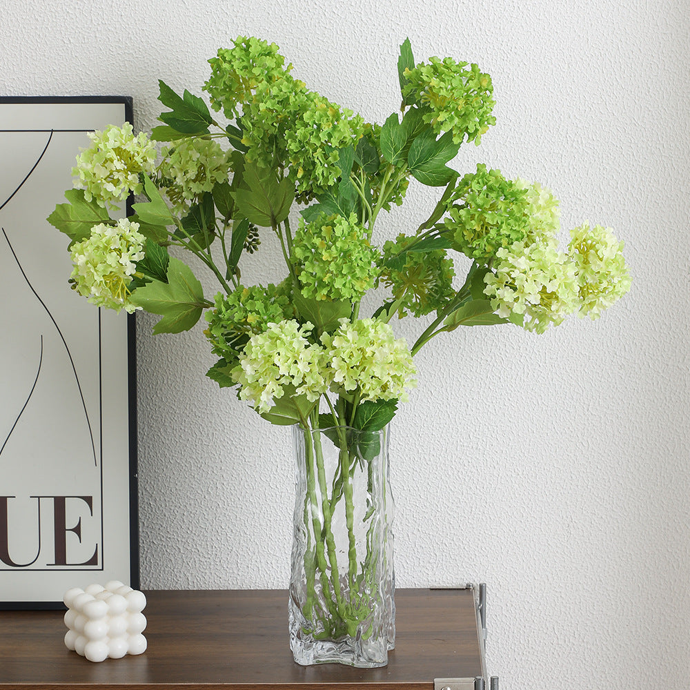Artificial hydrangea branch with vibrant flowers and detailed leaves