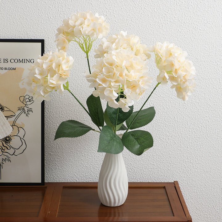 Decorative artificial flower arrangement