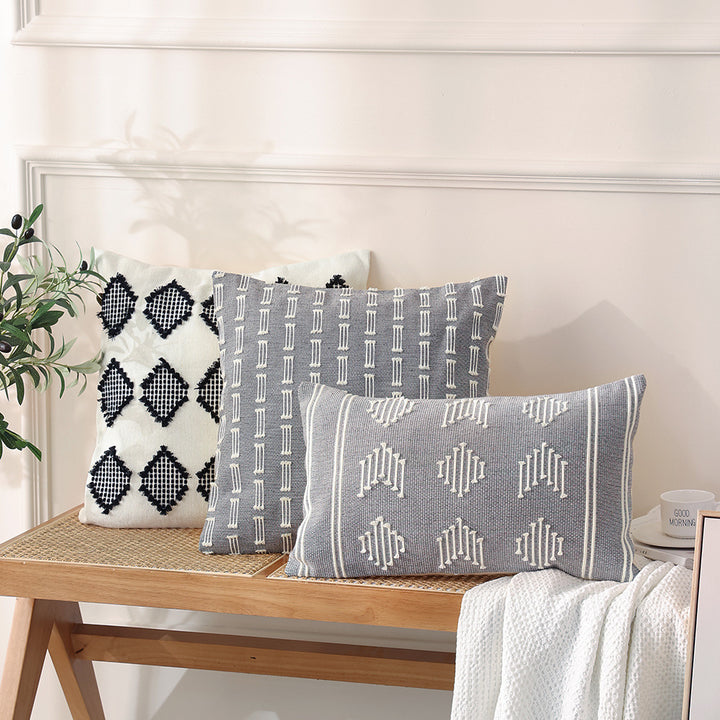 Woven decorative cushion cover with hand-tufted geometric pattern