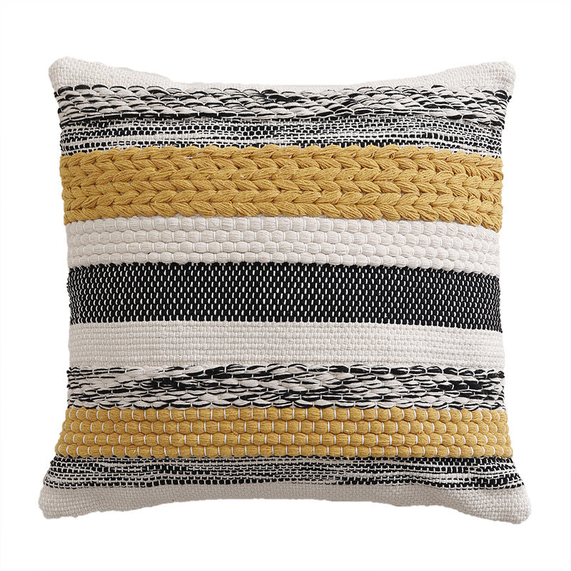 High-structured woven decorative cushion cover with fringes and bouclé application