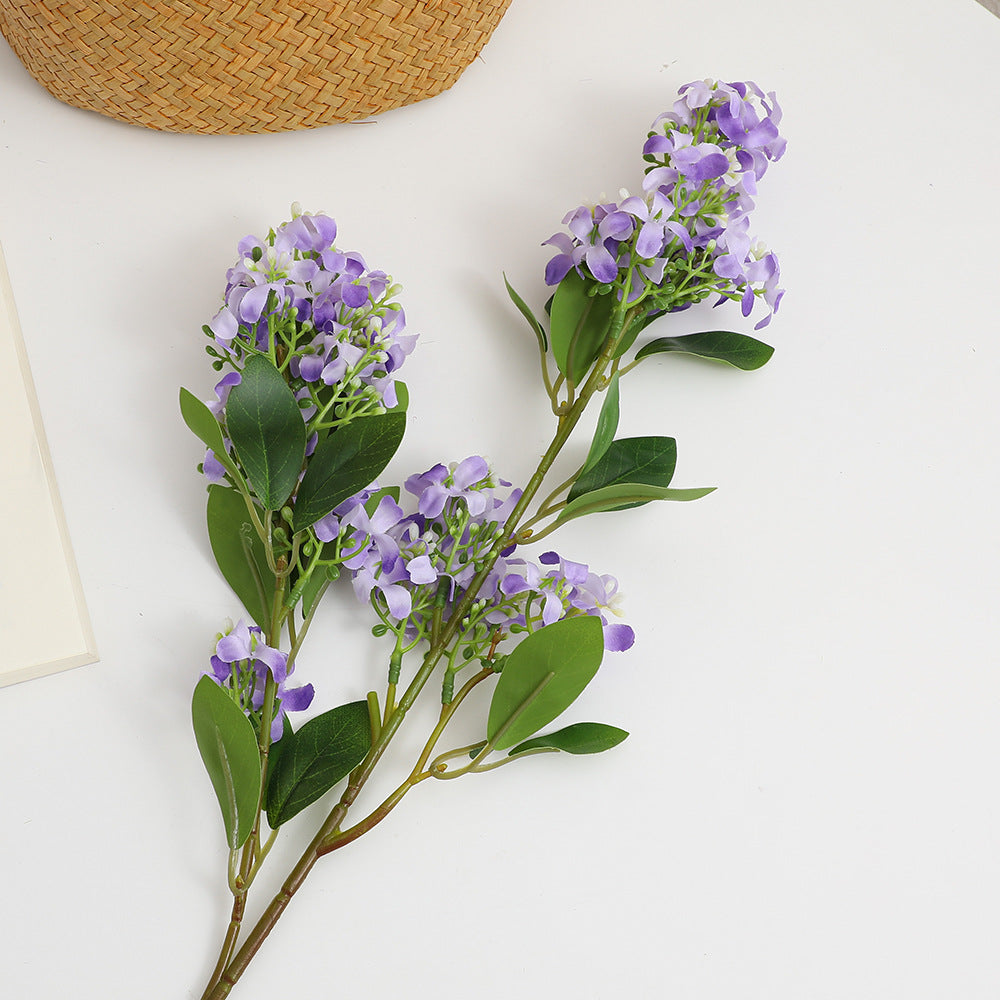 Artificial flower branch with bright flowers
