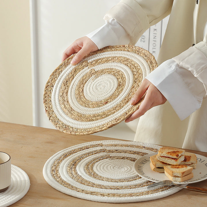 Braided round table mat made of cotton rope and sea grass with spiral structure