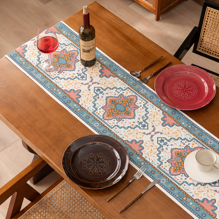 Woven table runner made of cotton blend with oriental medallion pattern and fringes