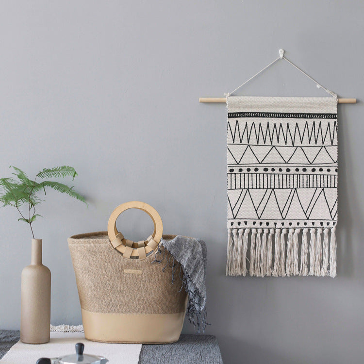 Woven Boho wall hanging with fringes and graphic ethnic pattern