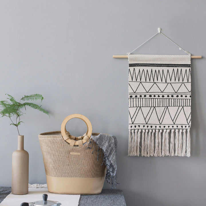 Woven Boho wall hanging with fringes and graphic ethnic pattern