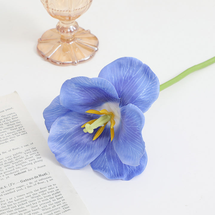 Artificial orchid flower branch with intricately detailed flowers