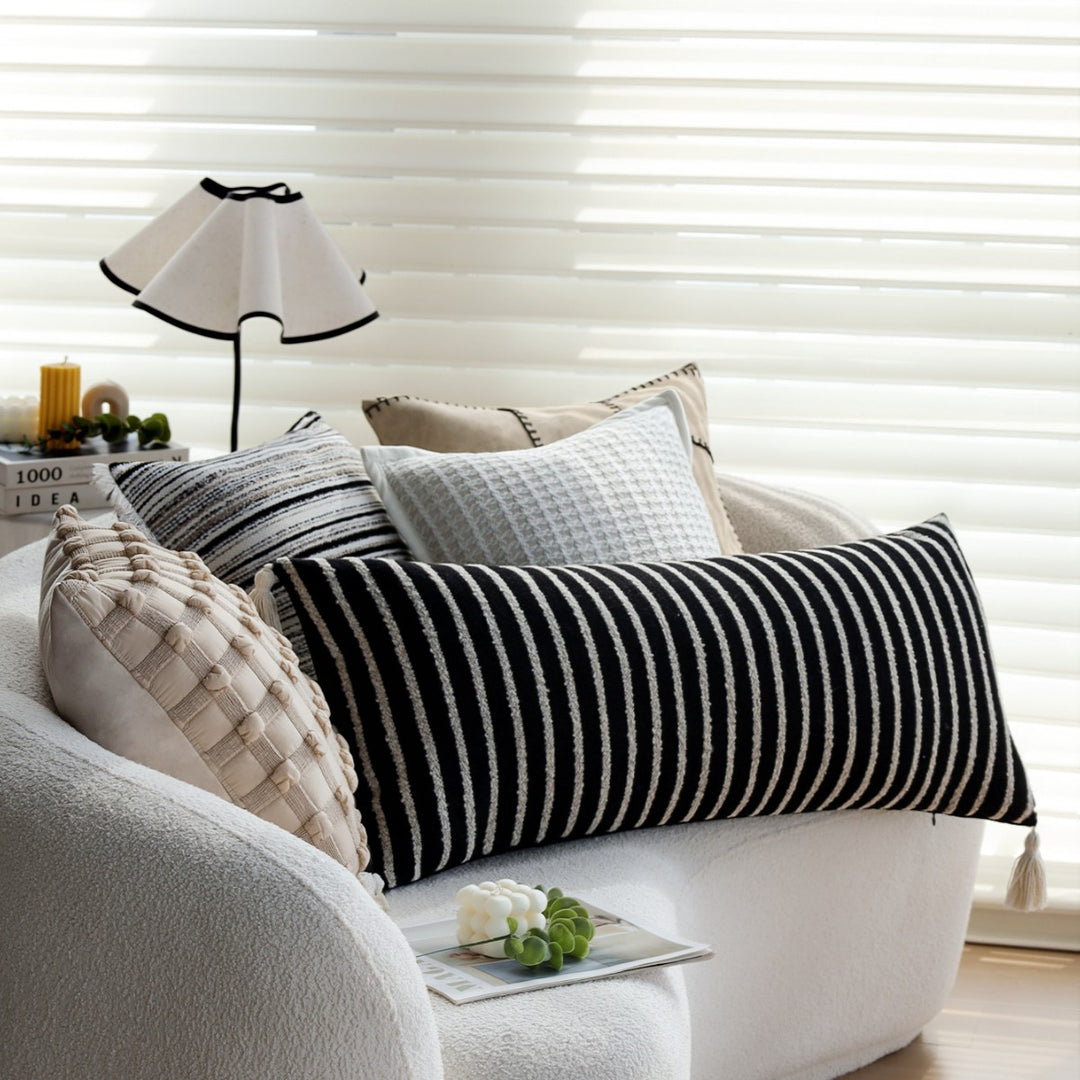 Woven home decor pillow cover with fine striped texture and hand-fringed edge