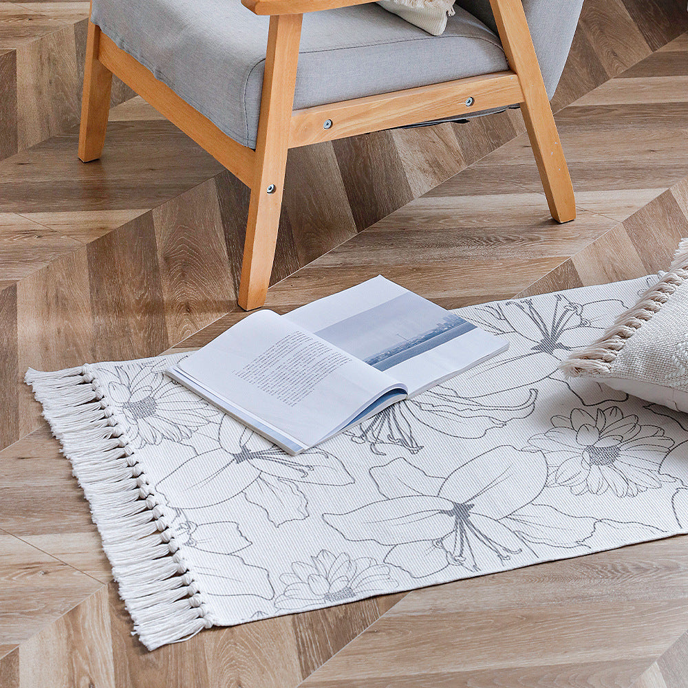 Decorative table runner made of cotton with botanical bird print and fringes