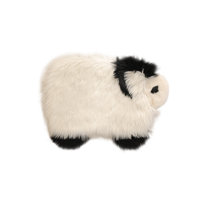 Plush cuddly pillow in sheep shape with dense artificial fur and soft polyester filling