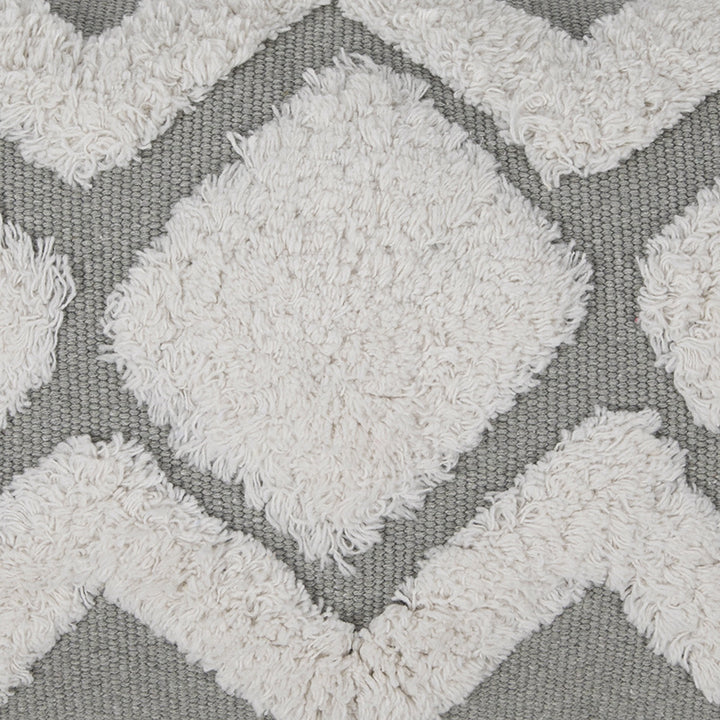 Structured living room carpet with 3D tufting and geometric diamond relief
