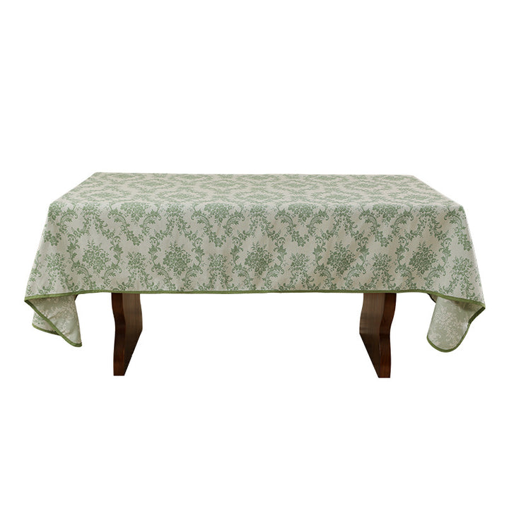 Jacquard tablecloth with floral damask pattern and reinforced hem