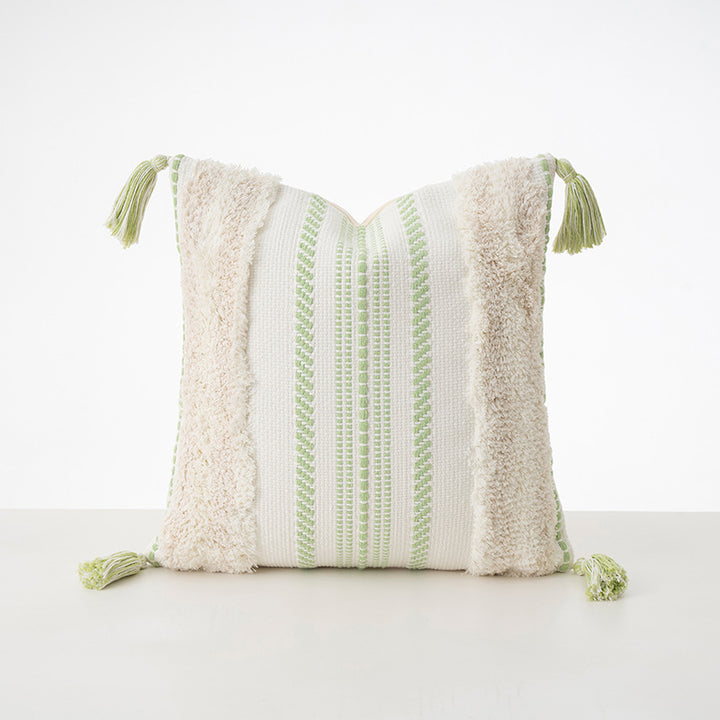 Square decorative cushion with boucle stripes, woven texture, and corner tassels