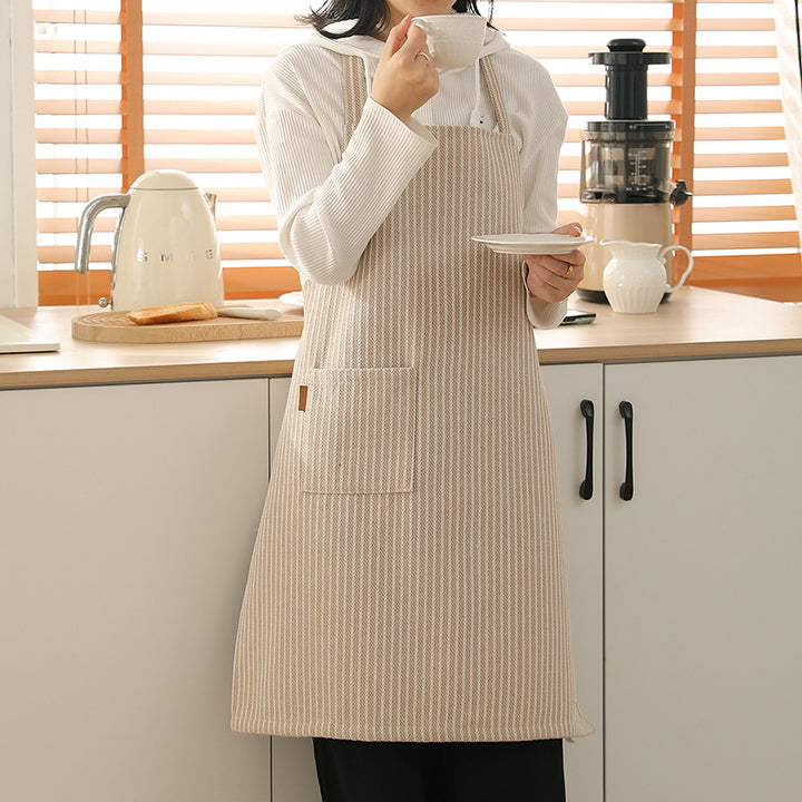 Bib apron made of cotton blend with patch pocket and lace trim