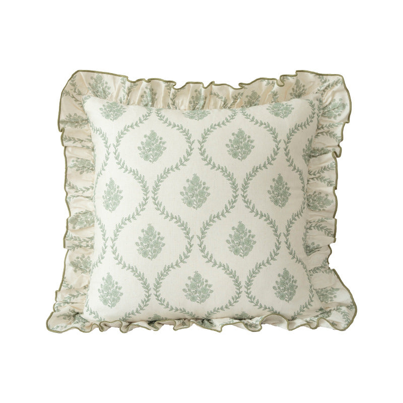 Decorative pillow with ruffles and floral linen cover