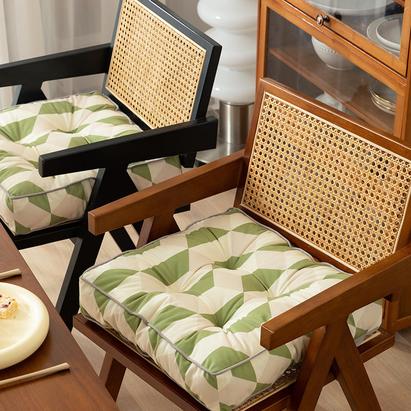 Padded chair cushion with ties and tufted seat