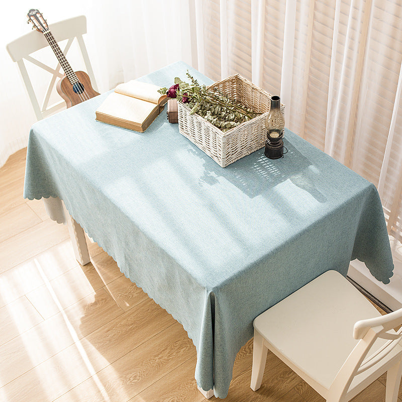 Rectangular tablecloth in linen look with wavy arc edge