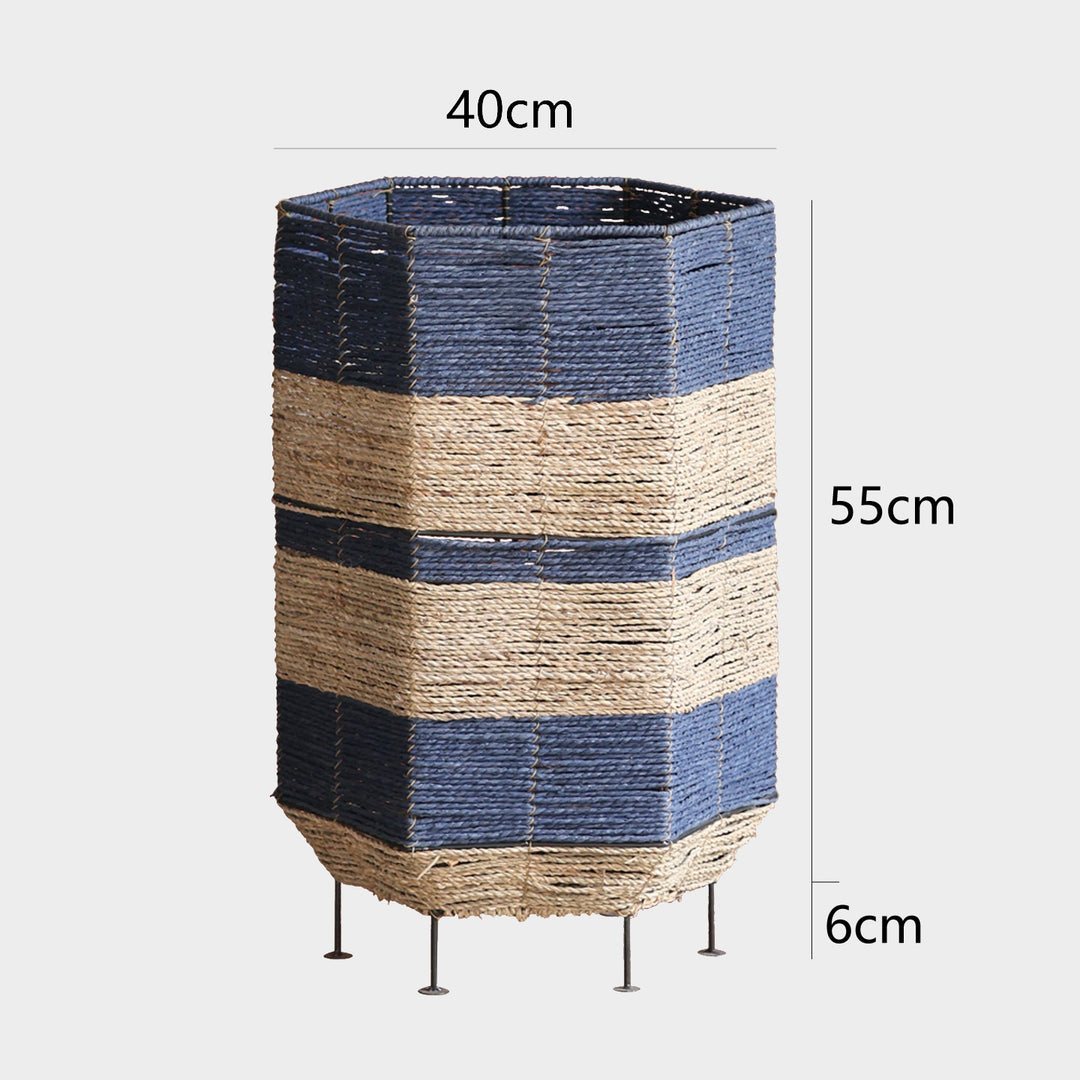 Stylish laundry basket made of rattan with metal legs