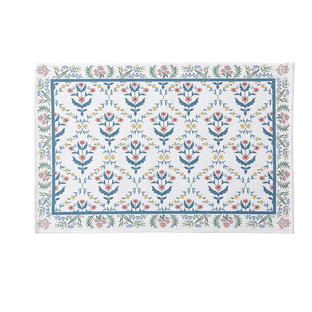 Woven cotton bath mat with floral allover jacquard pattern