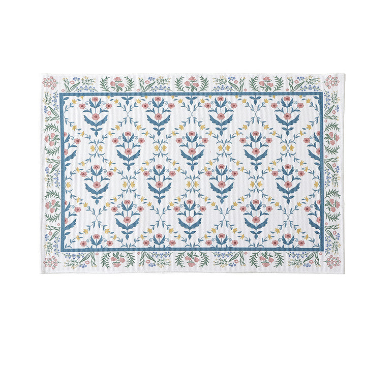 Woven cotton bath mat with floral allover jacquard pattern