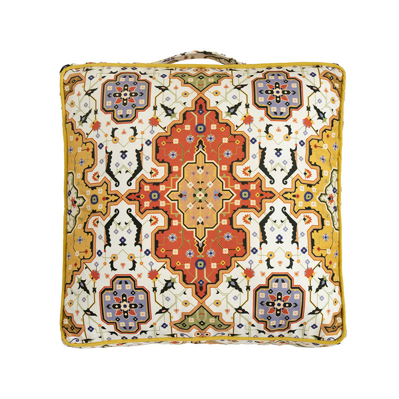 Square decorative cushion with oriental medallion print, piping and carrying handle