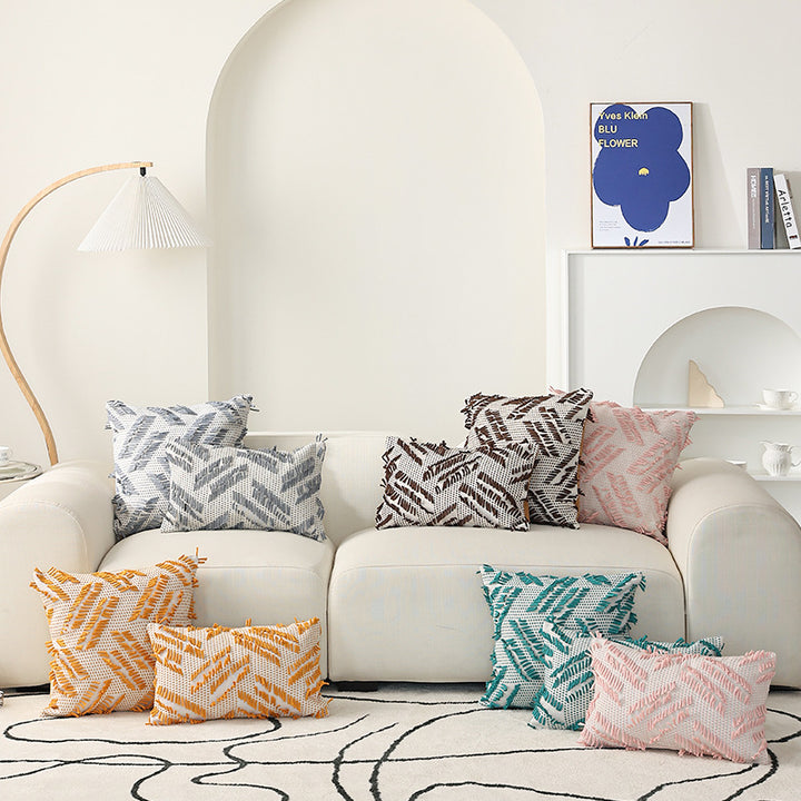 Decorative pillow with woven chenille relief structure and fringe application