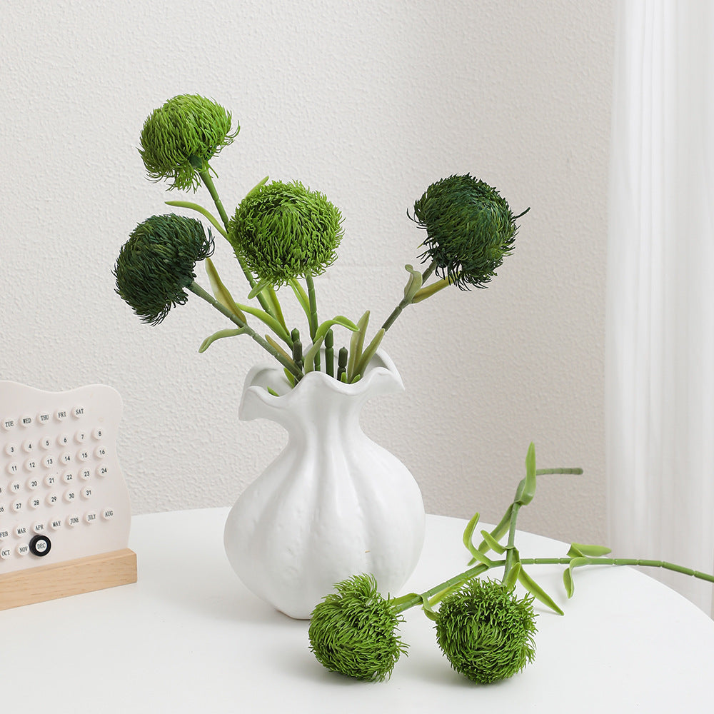 Decorative artificial flower branch with a natural appearance