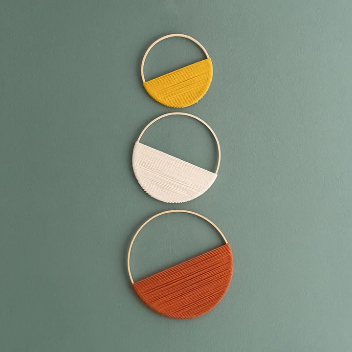 Modern wall art piece made of macrame and wood