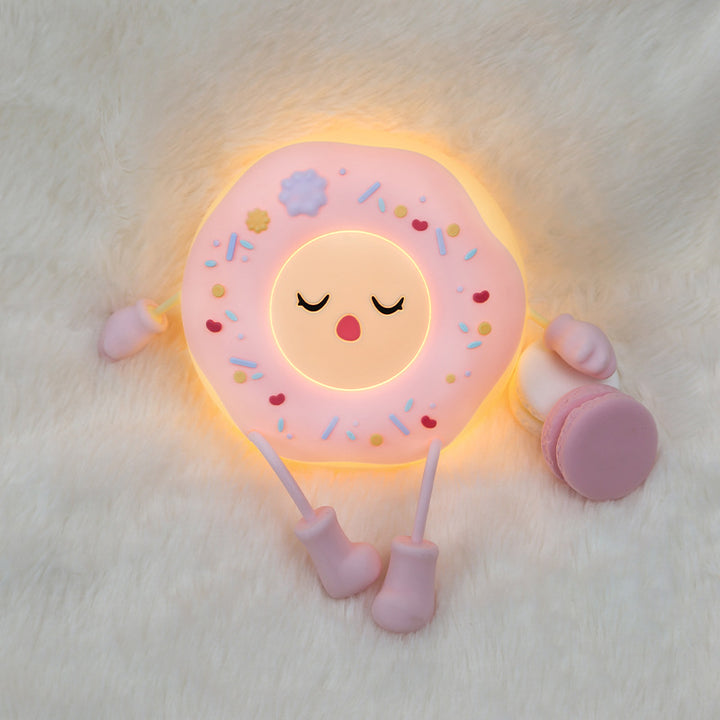 Whimsical silicone-shaped LED night light in donut form with flexible limbs