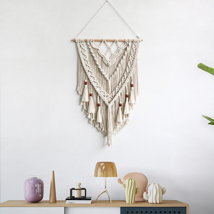 Hand-woven macrame wall hanging with decorative tassels