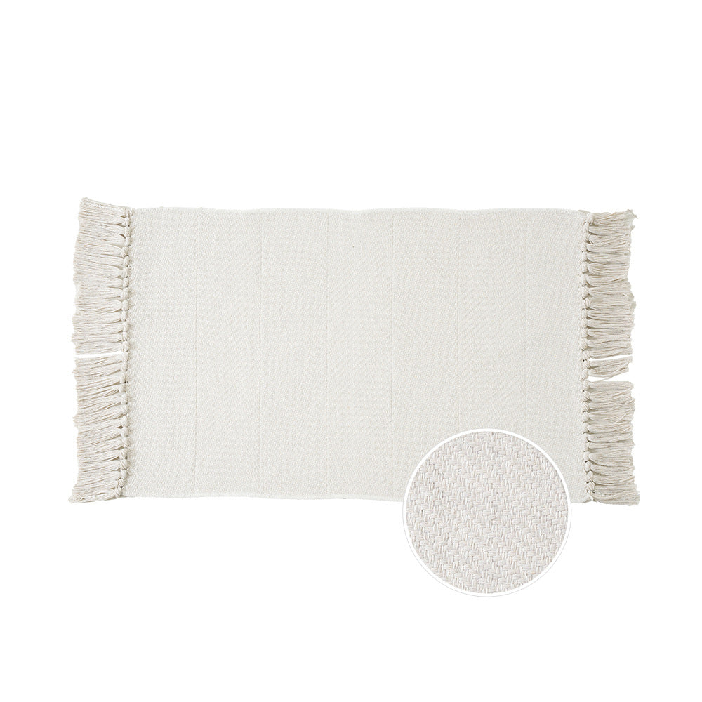 Woven table runner with dense herringbone jacquard and fringes