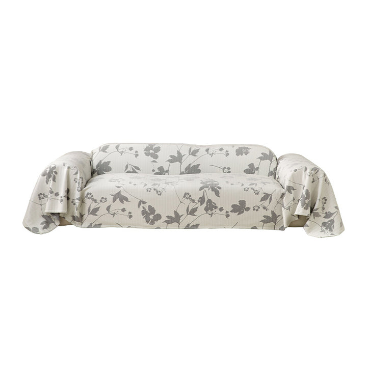 Universal sofa cover with floral relief and elastic hem