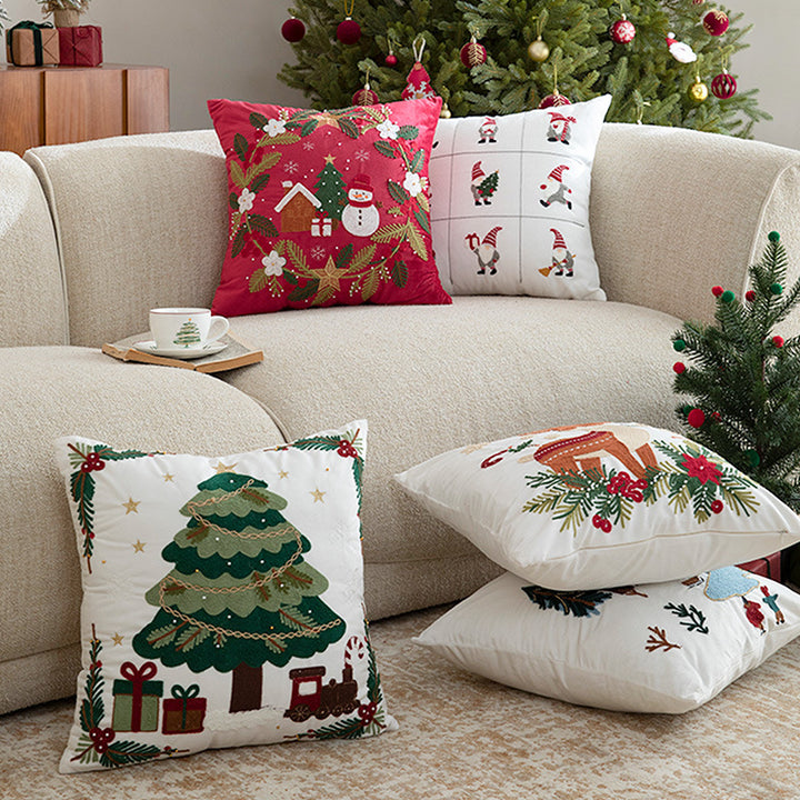 Festive embroidered decorative pillow with reindeer motif and removable cover