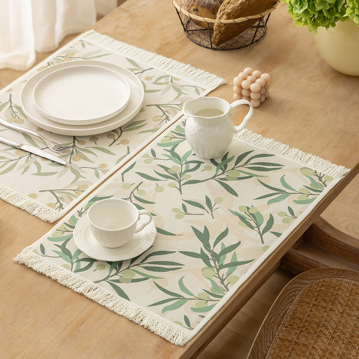 Floral woven bath mat with decorative fringes