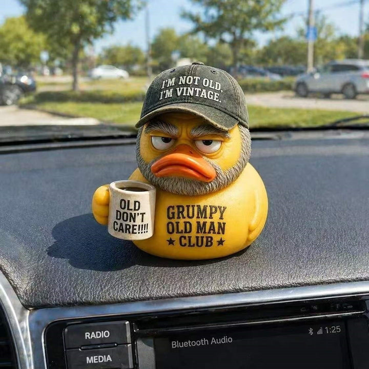 Funny rubber duck with vintage hat and cup