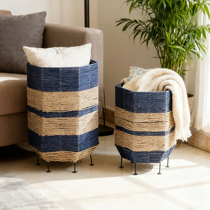Stylish laundry basket made of rattan with metal legs