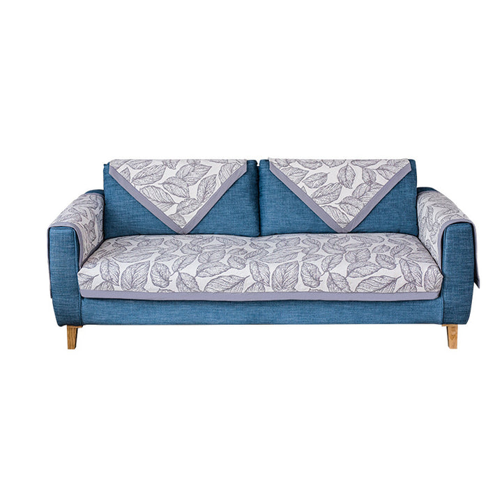 Universal sofa protective cover for three-seater with leaf print, non-slip underside and separate armrest covers