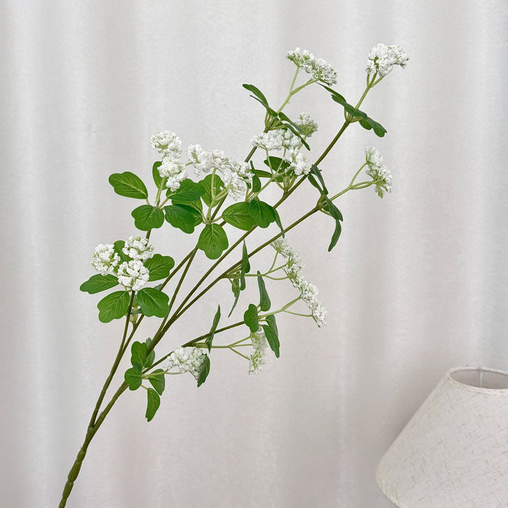 Artificial blossom branch with purple flowers
