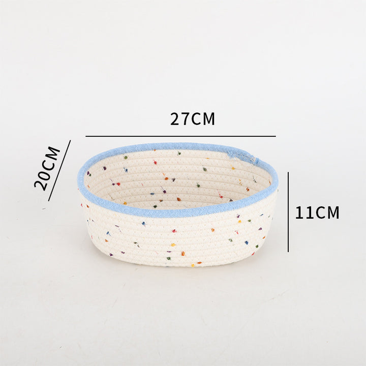 Storage basket made of natural cotton fabric with colorful dots