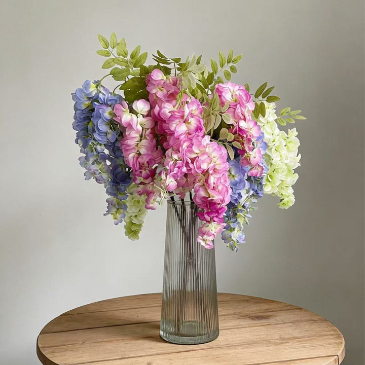 Artificial flower branch with lifelike, hanging flowers