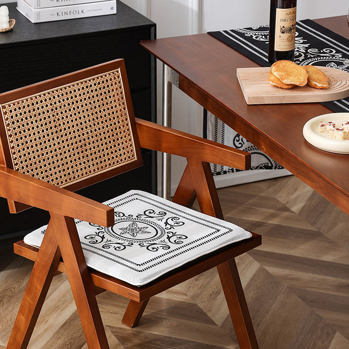 Double-sided seat cushion with ties and decorative jacquard pattern