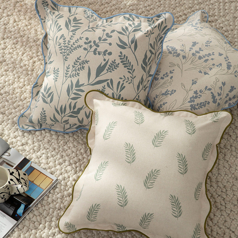 Decorative square decorative pillow with floral print, curved edge and removable cover