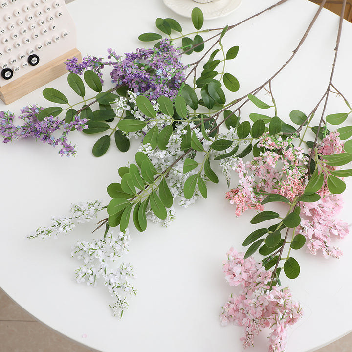 Artificial flower branch with vibrant purple flowers