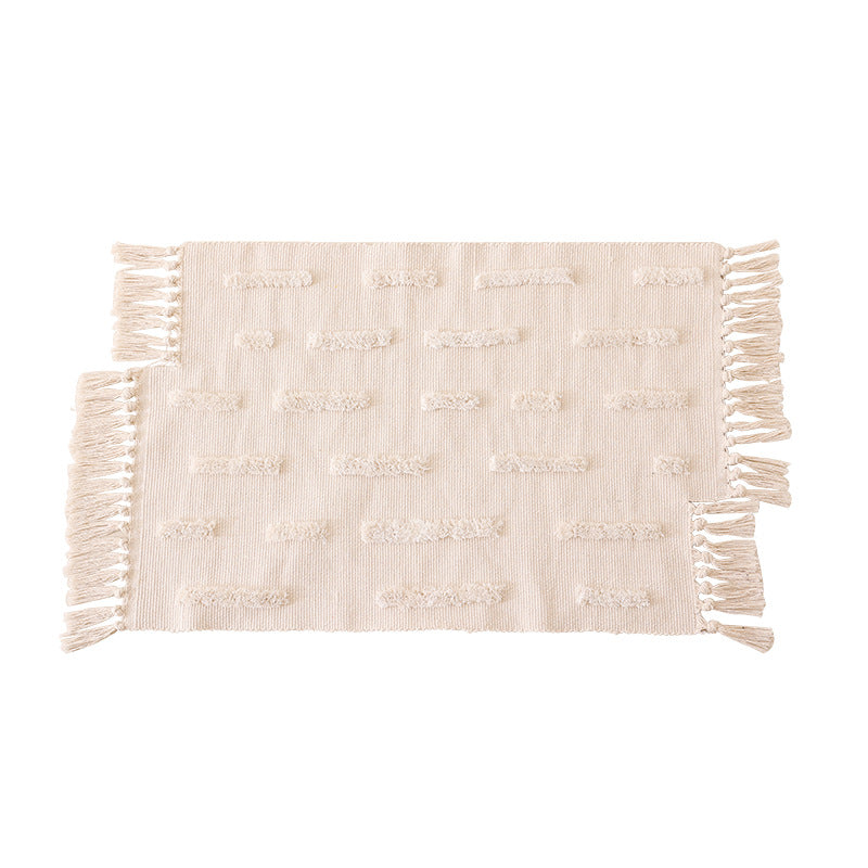 Woven rug in Boho-minimalist style with contrasted tufting and cotton fringes