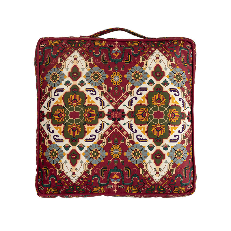 Square decorative cushion with oriental medallion print, piping and carrying handle